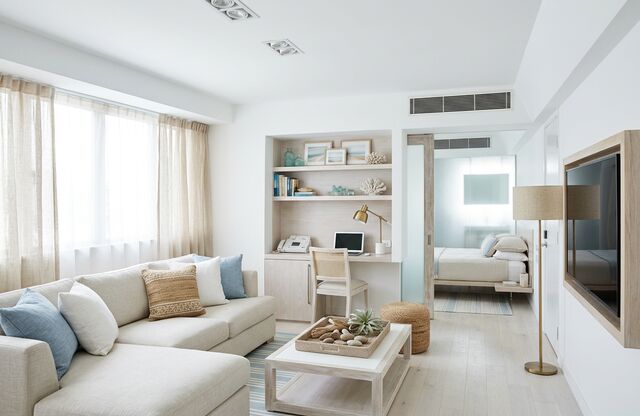 A living room redesigned by AI in the Coastal style