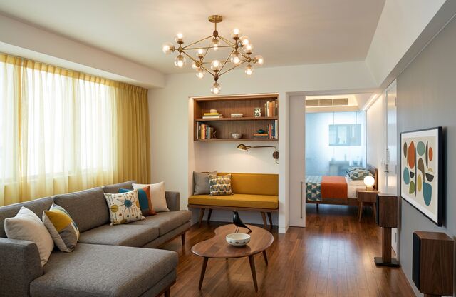 A living room redesigned by AI in the Mid-century style